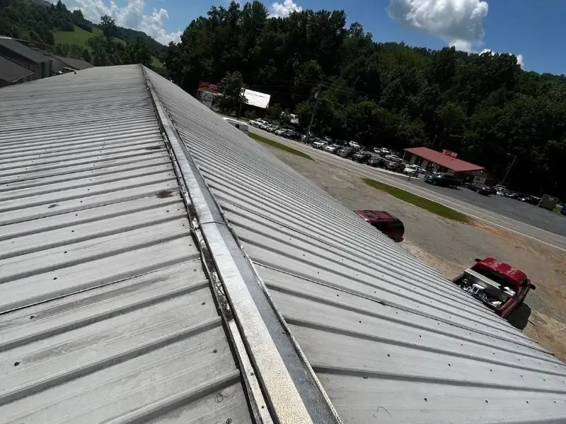 Metal Roof Repair Conroe TX 3 Commercial metal roof repair on a warehouse building in Conroe TX