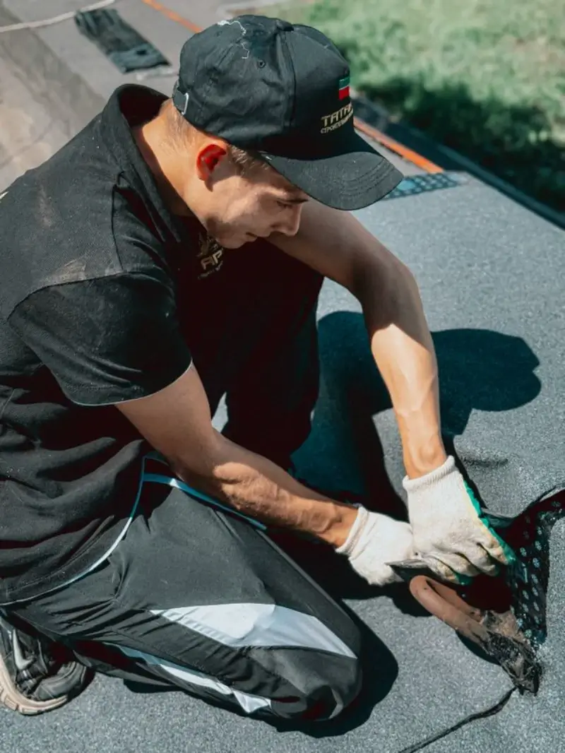 Flat Roof Repair Conroe TX 1 Damaged flat roof area being repaired on a building in Conroe TX