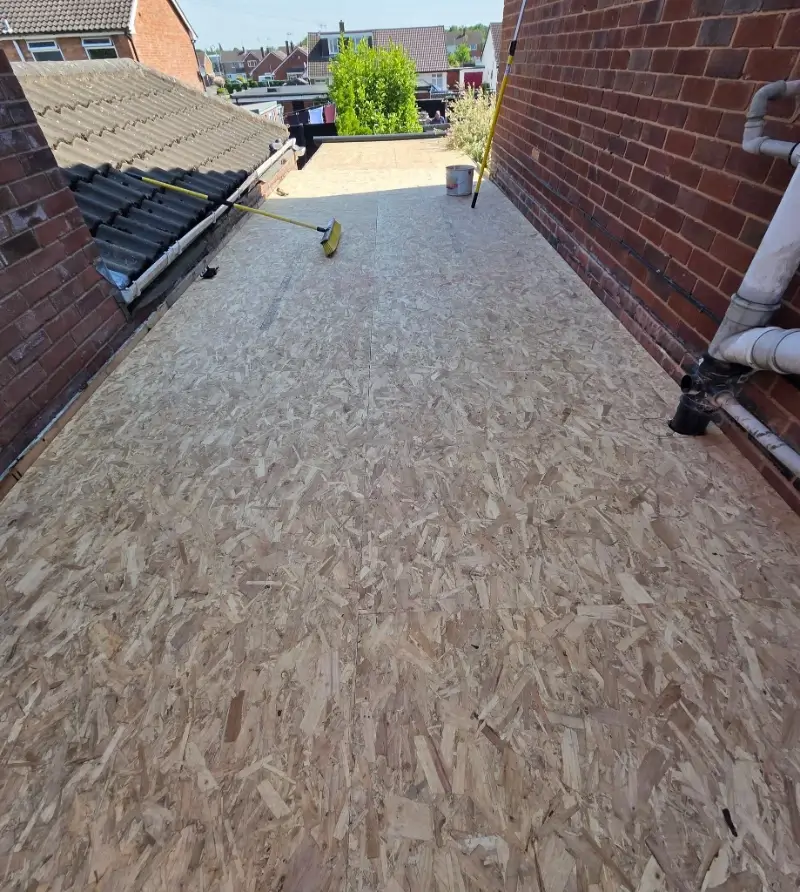 Flat Roof Repair Conroe TX 5 Flat roof deck and insulation work during a low-slope roof repair in Conroe TX