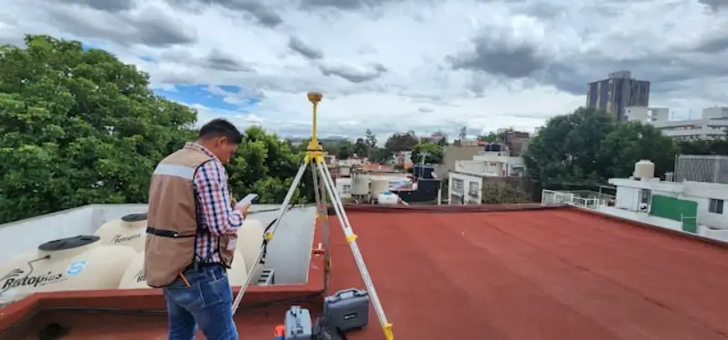 Flat Roof Repair Conroe TX 4 Roofer inspecting a flat roof in Conroe TX to trace the source of a leak