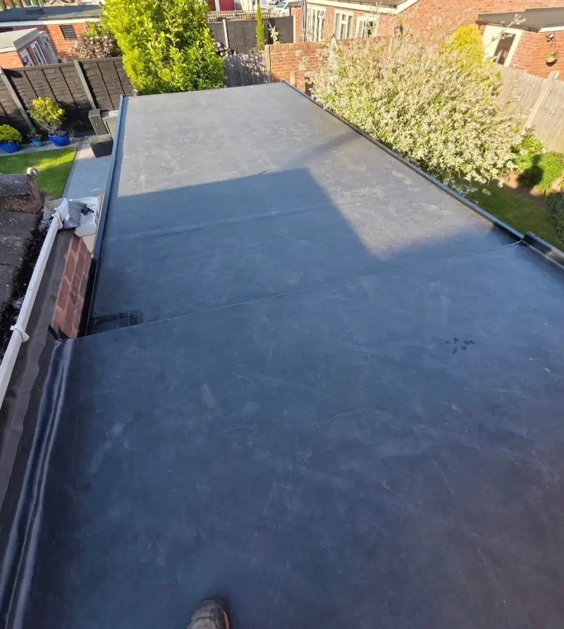 Flat Roof Repair Conroe TX 2 TPO and EPDM flat roof membrane work on a low-slope roof in Conroe TX