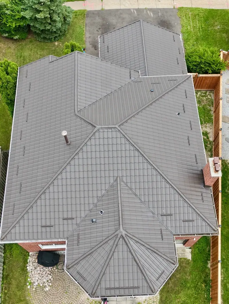 Metal Roof Repair Conroe TX 5 Metal roof repair contractor replacing fasteners and sealing a panel seam in Conroe TX