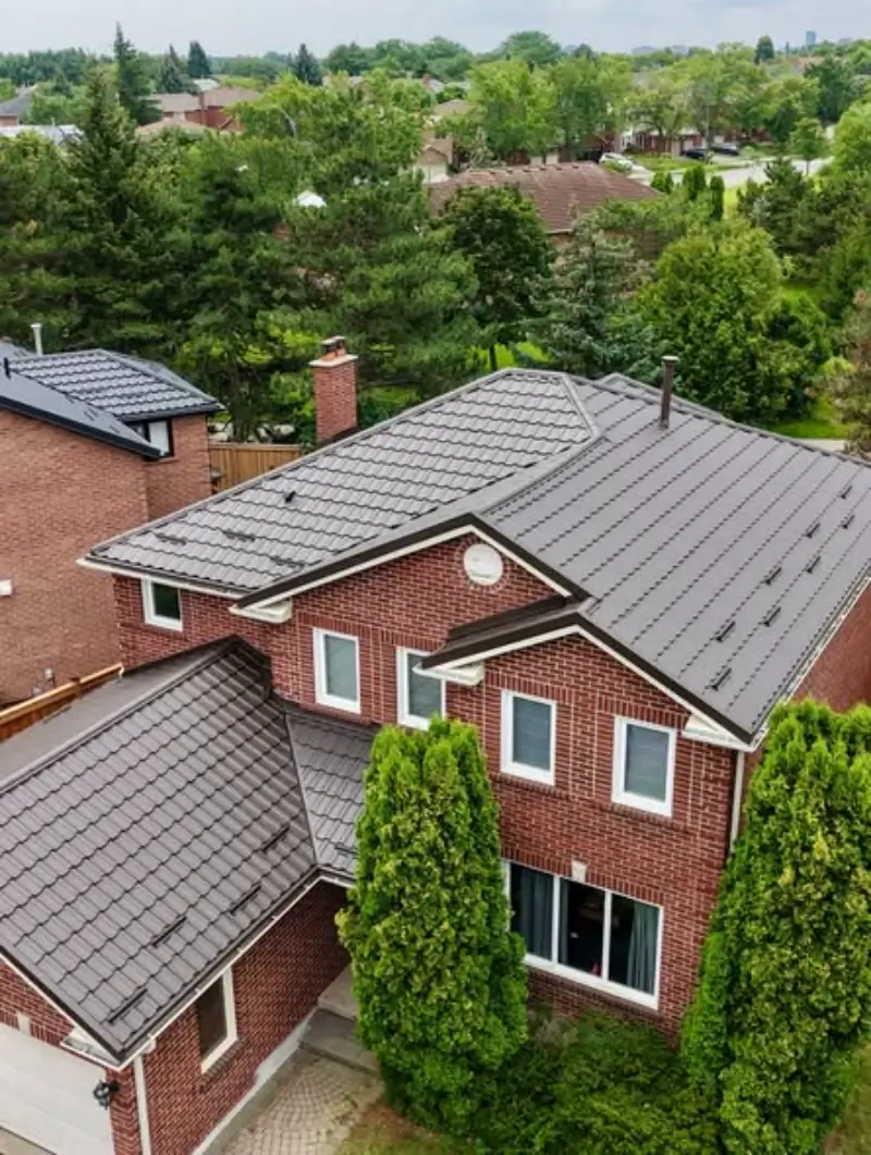 Metal Roof Repair Conroe TX 7 Storm damaged residential metal roof panels being repaired in Conroe TX